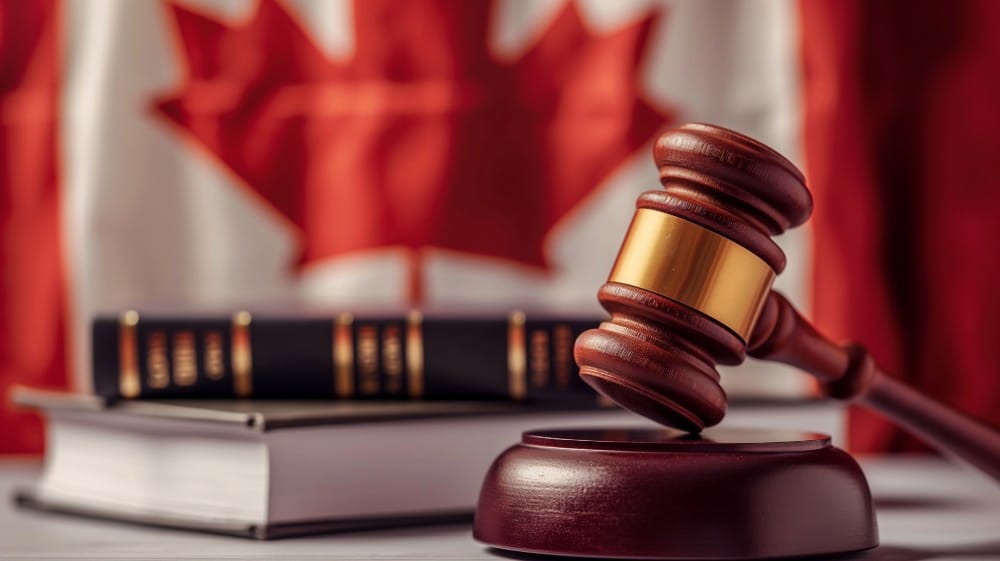 statute of limitations for indictments in Ontario Canada portrayed by a gavel in front of legal texts and a Canadian flag.